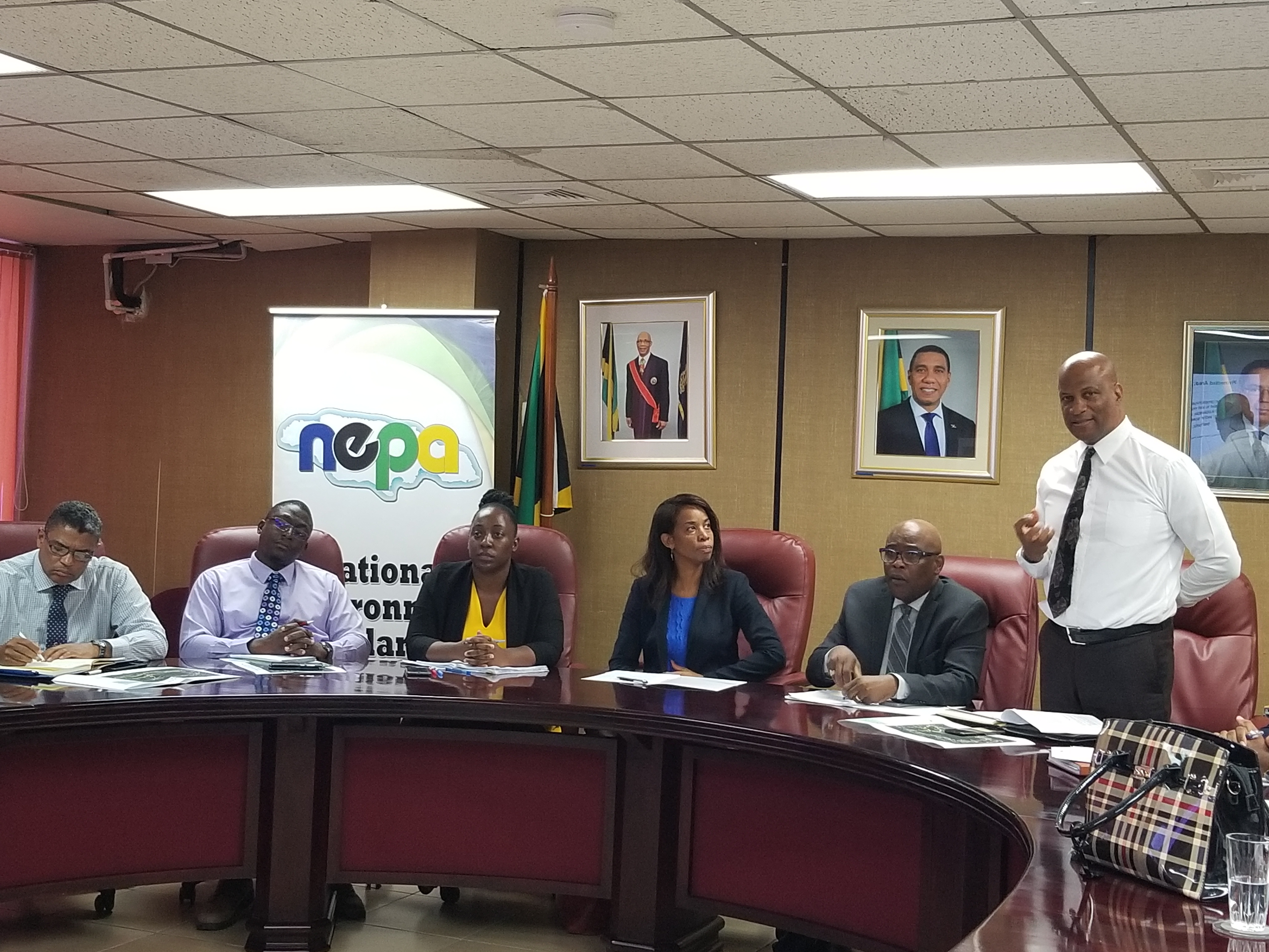 Mr Anthony McKenzie (standing), Director, Environmental Management and Conservation Division, NEPA delivering a presentation on the Proposed Cockpit Country Protected Area at the Cockpit Country Protected Area briefing.