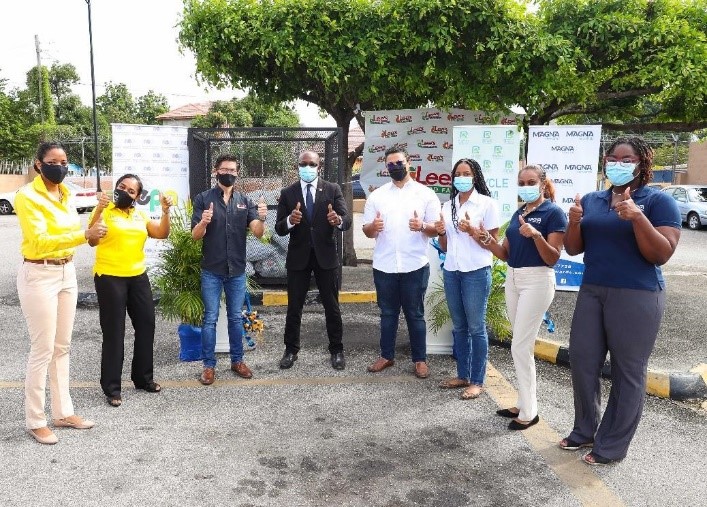 Minister of Housing, Urban Renewal, Environment and Climate Change Hon. Pearnel Charles Junior celebrates with Recycling Partners of Jamaica, Magna Rewards, Lee’s Food Fair and NEPA on the successful launch of the National Supermarket Plastic Recyclables drop off centre programme. Looking on are: L-R- Kashta Graham, Project Manager, Plastic Waste Minimization Project, Lisa Kirkland, Manager, Pollution Monitoring and Assessment Branch, NEPA, Patrick Lee of Lee’s Food Fair Ltd., Jonathan Beckford, Logistics O