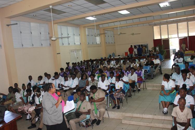 Ms. Ava Tomlinson, Senior Public Education Officer and Community Outreach Officer, NEPA, guiding participants through the programme at the NEPA CSEC Sensitization Session held at the Cecil Charlton Hall, Manchester on October 10, 2018.