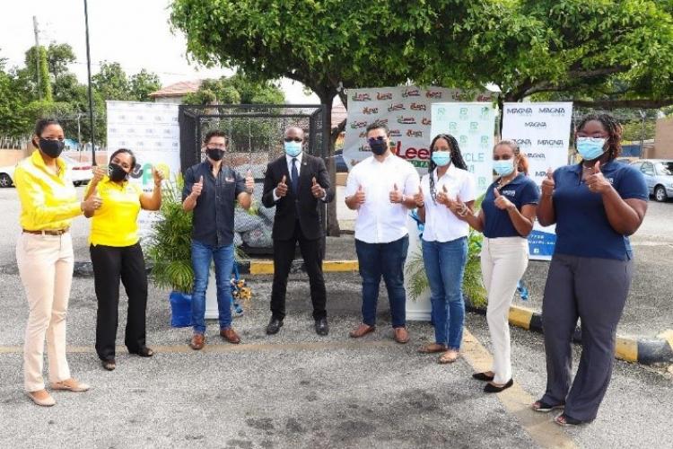 Minister of Housing, Urban Renewal, Environment and Climate Change Hon. Pearnel Charles Junior celebrates with Recycling Partners of Jamaica, Magna Rewards, Lee’s Food Fair and NEPA on the successful launch of the National Supermarket Plastic Recyclables drop off centre programme. Looking on are: L-R- Kashta Graham, Project Manager, Plastic Waste Minimization Project, Lisa Kirkland, Manager, Pollution Monitoring and Assessment Branch, NEPA, Patrick Lee of Lee’s Food Fair Ltd., Jonathan Beckford, Logistics O